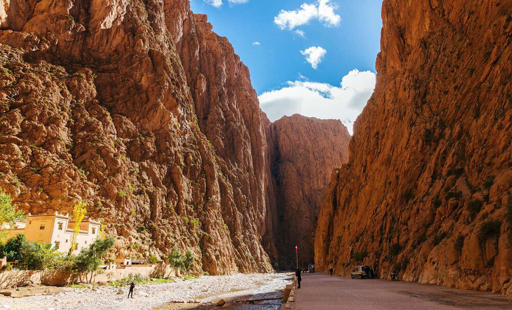 Sunrise over Sahara desert with dramatic shadows on sand dunes